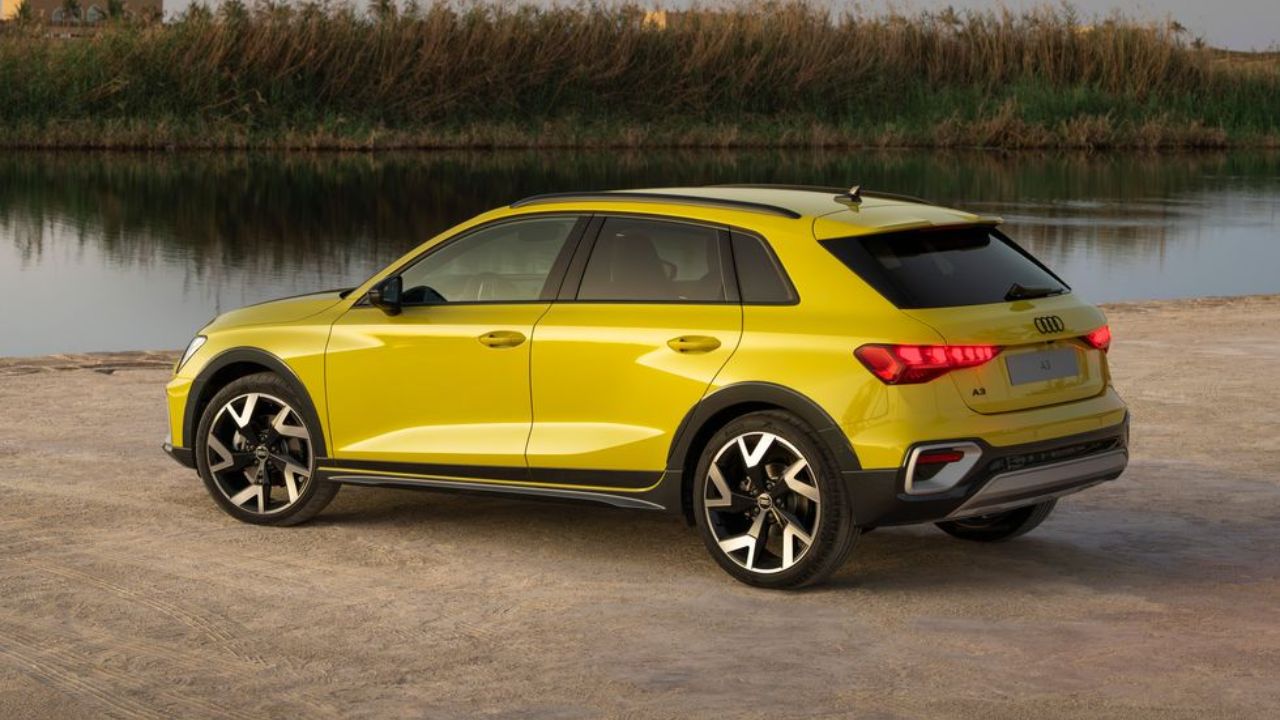 Audi A3 Allstreet in yellow color near pond