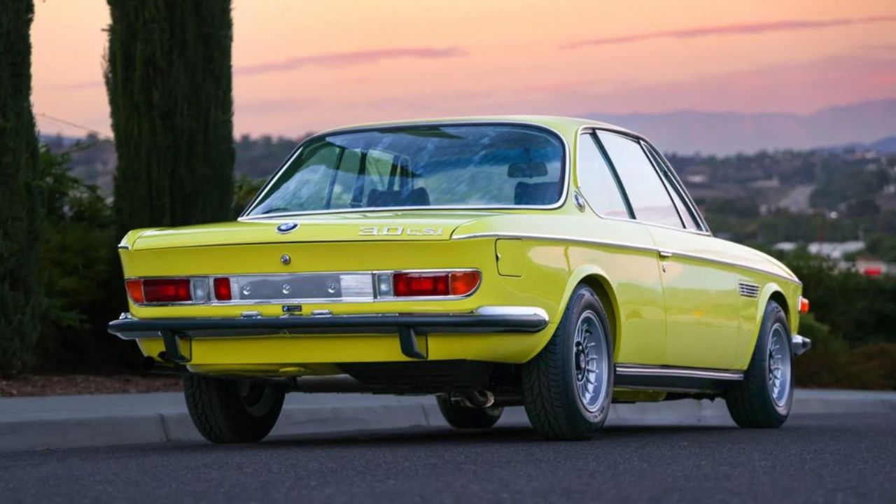 BMW 3.0CSi Coupe in yellow color in background of road