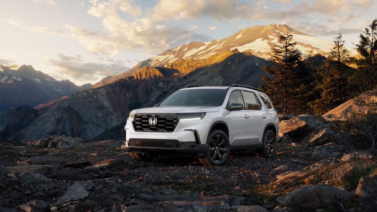 Honda Pilot in white color on mountains background