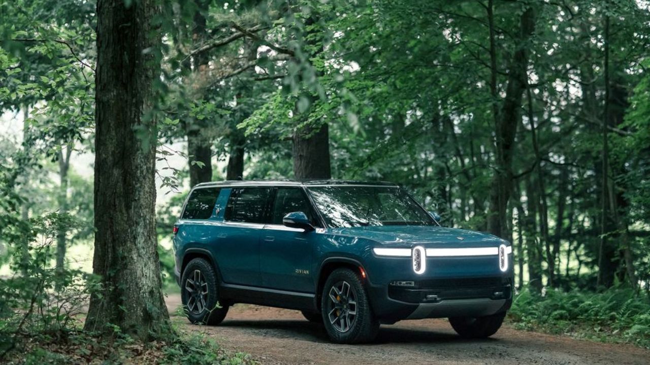 Rivian R2 in blue color in foresty area